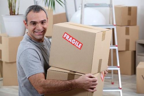 Local removals team handling furniture loading in Balham