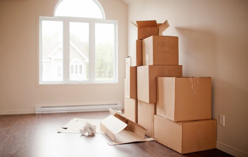 Boxes and furniture arranged in a new home after a Balham move