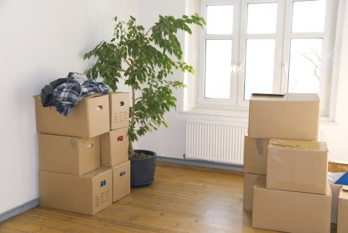 Packed moving boxes and desk items prepared for a student move